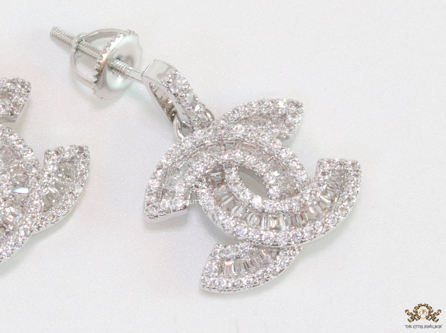 Platinum plated cz dangle earrings with twin C motif