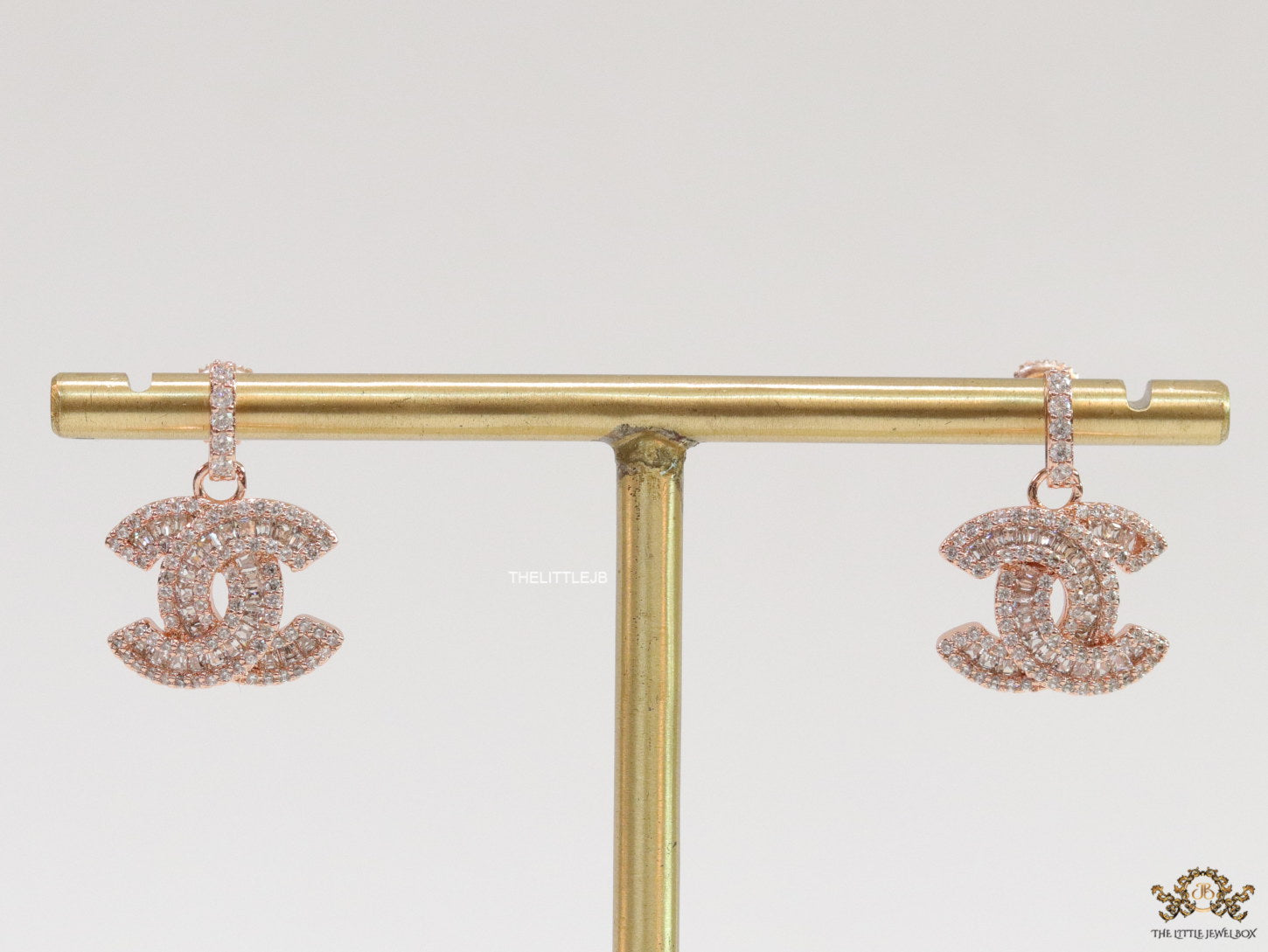 Rose gold plated cz dangle earrings with twin C motif