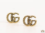 Double G motif studs with rope texture in antique gold finish