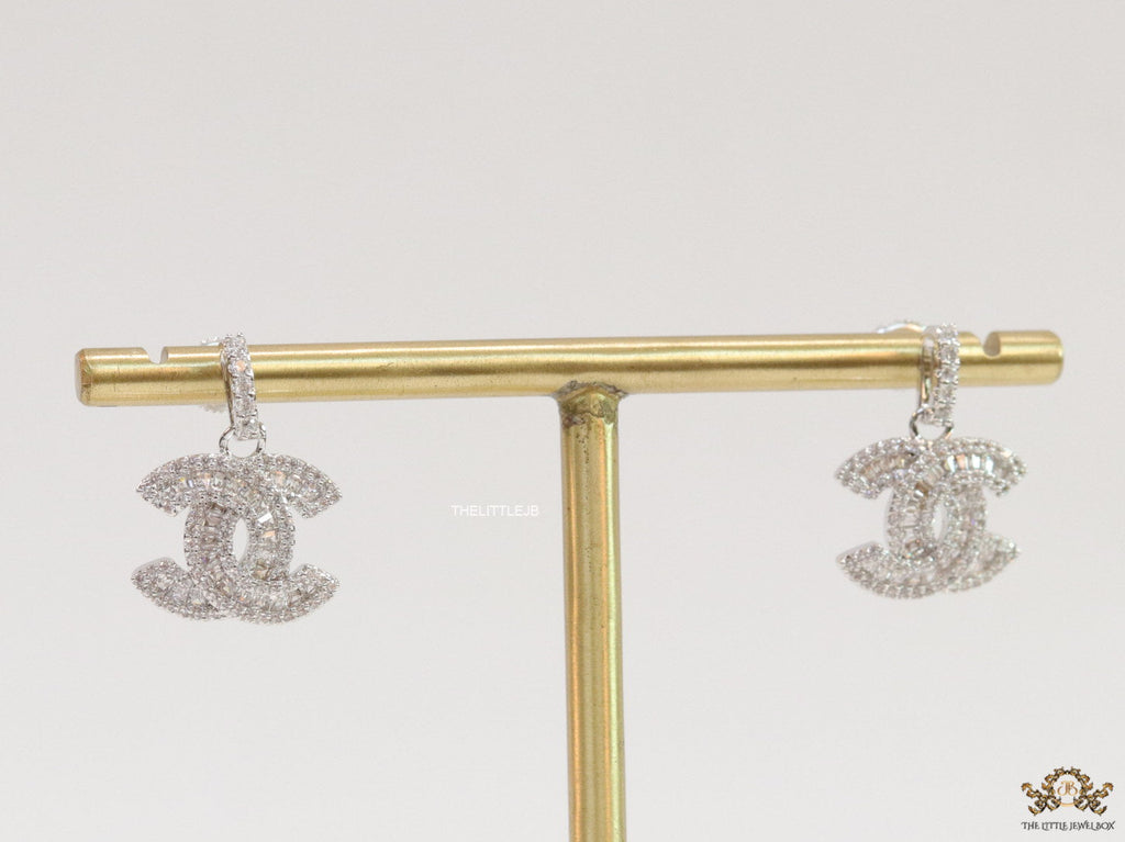 Platinum plated cz dangle earrings with twin C motif