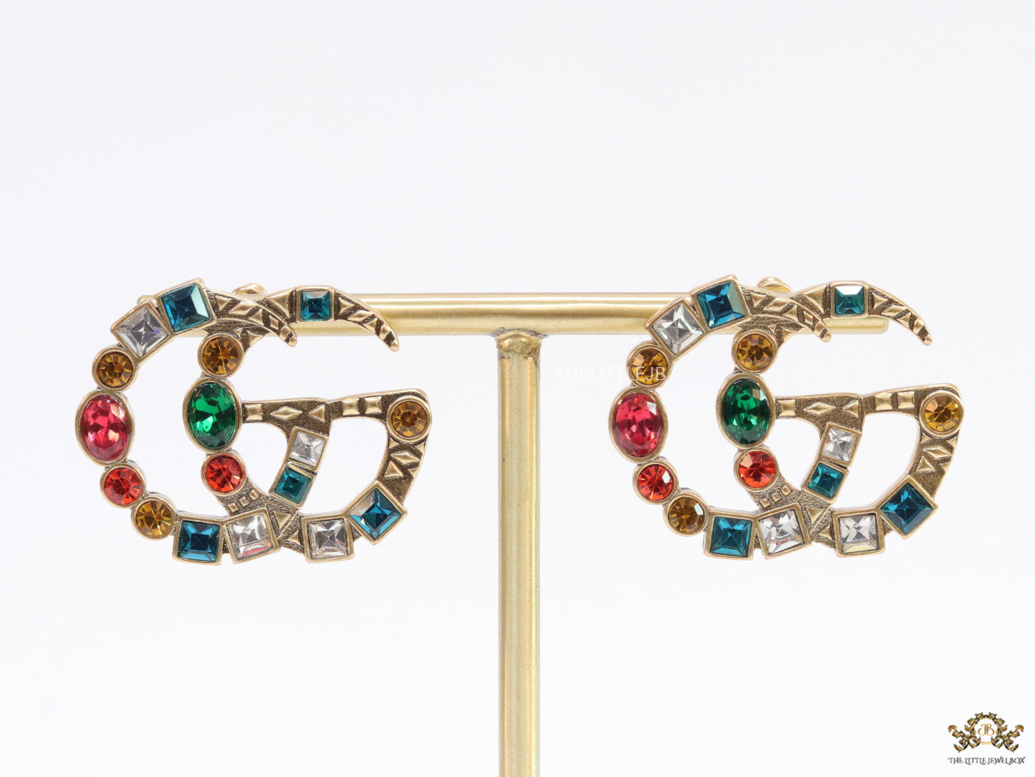Double G golden earrings with multicolor cz stones