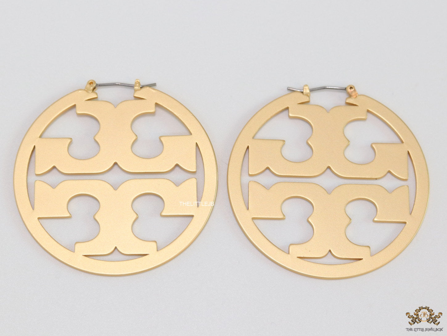 Matt Gold hoops with T motifs