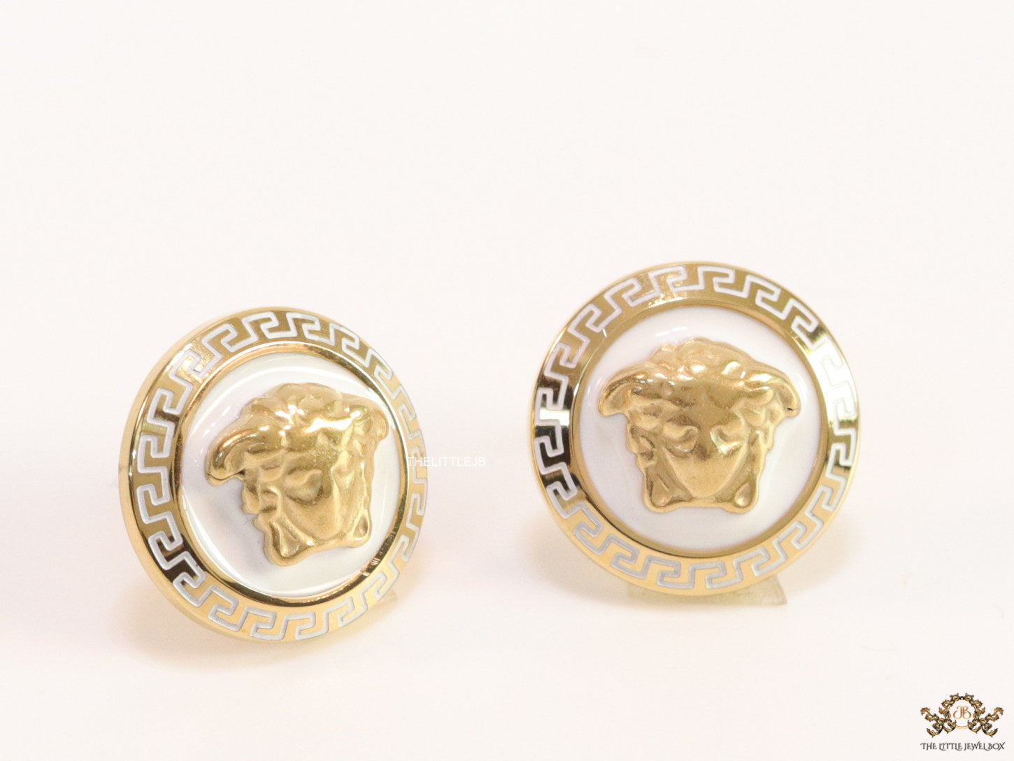 Golden 3D Medusa motif on white base and golden details studs