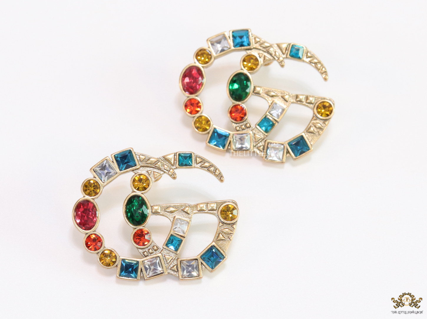 Double G golden earrings with multicolor cz stones