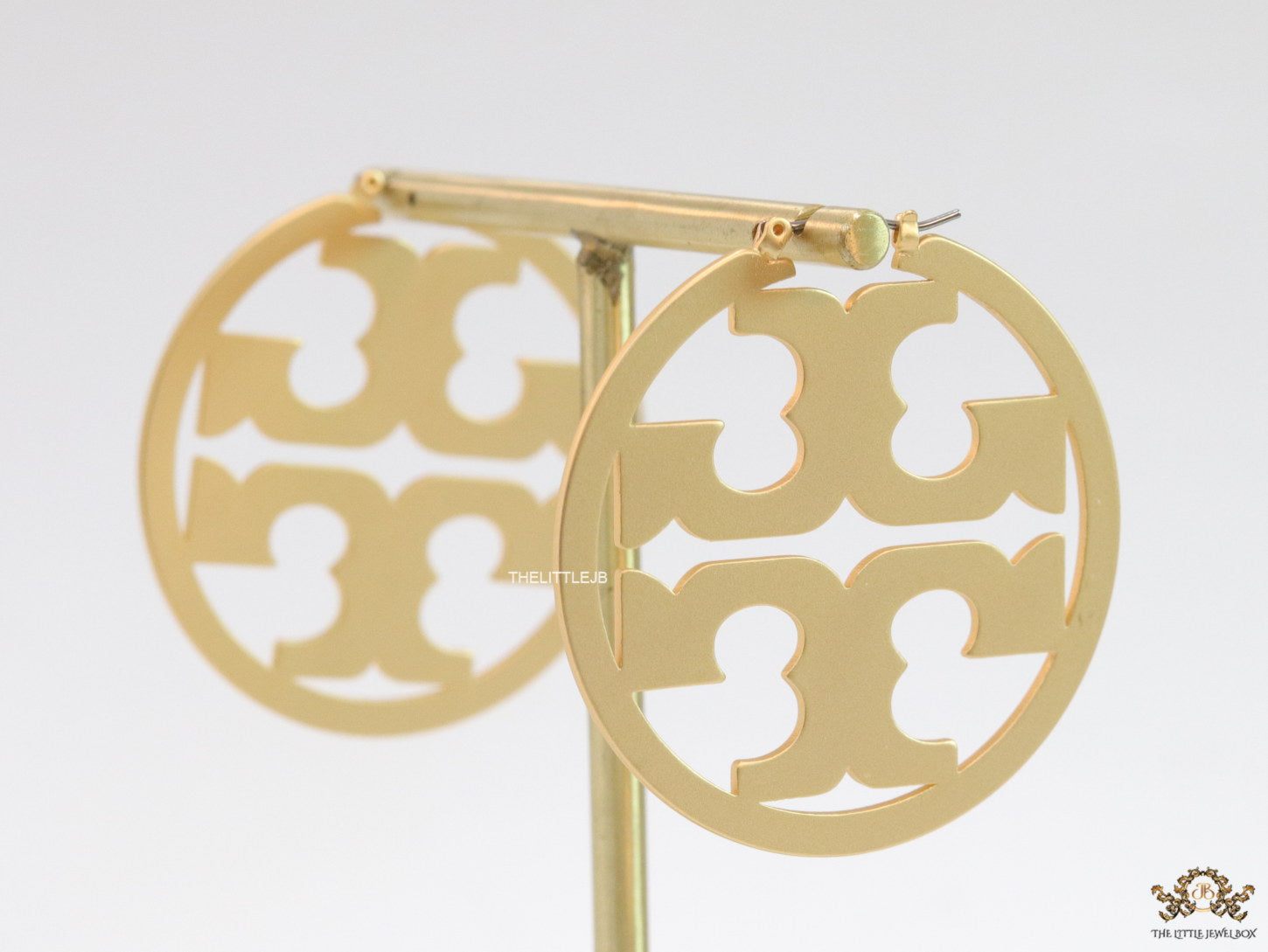 Matt Gold hoops with T motifs