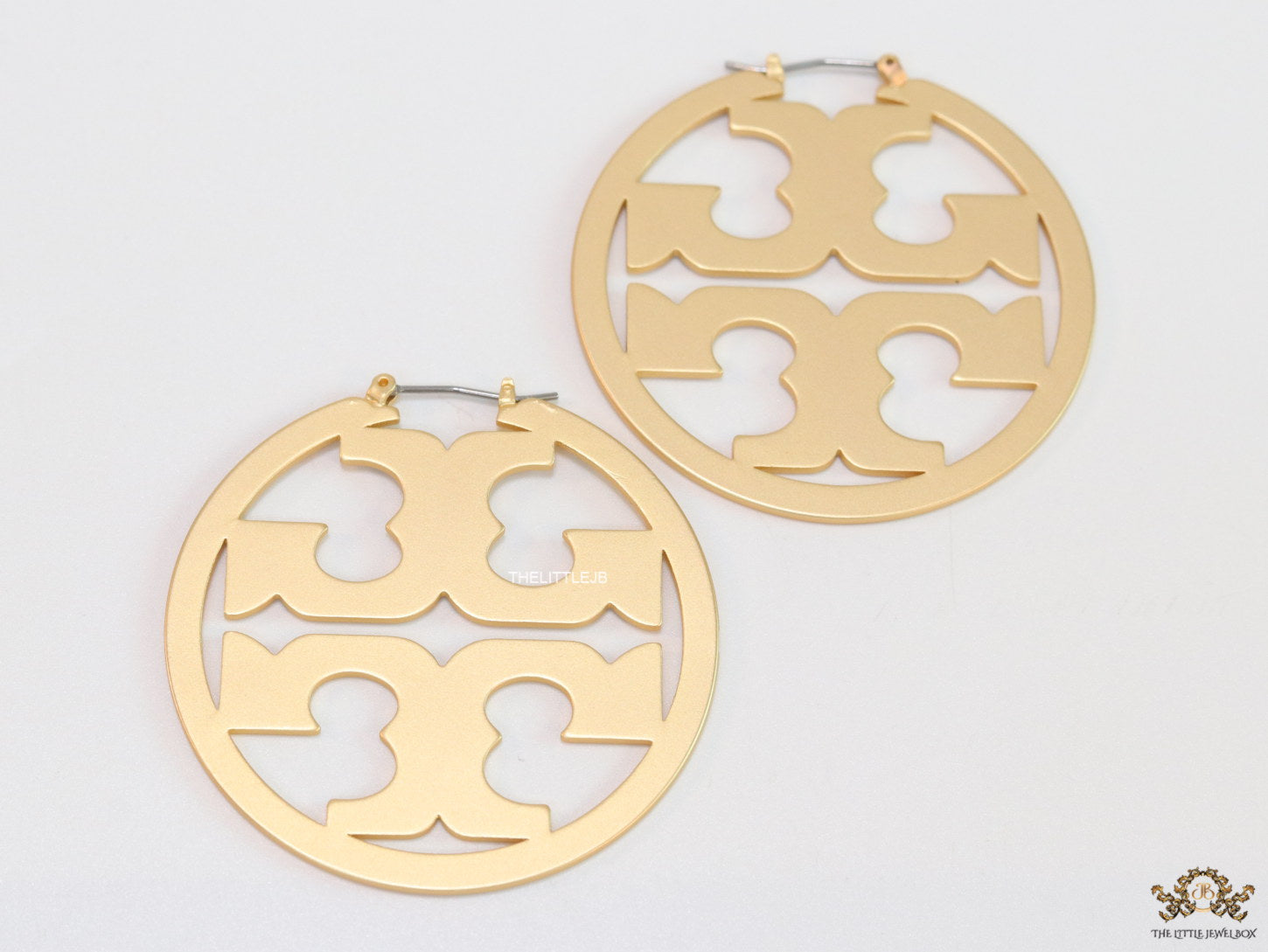 Matt Gold hoops with T motifs