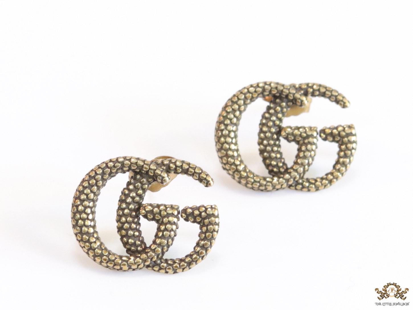 Antique gold plated double G motif studs with honey comb texture