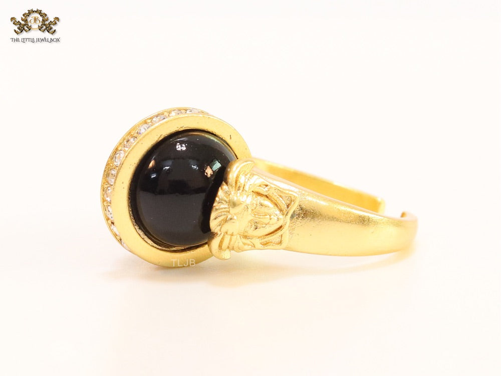 Double gold Medusa with CZ on black ball ring