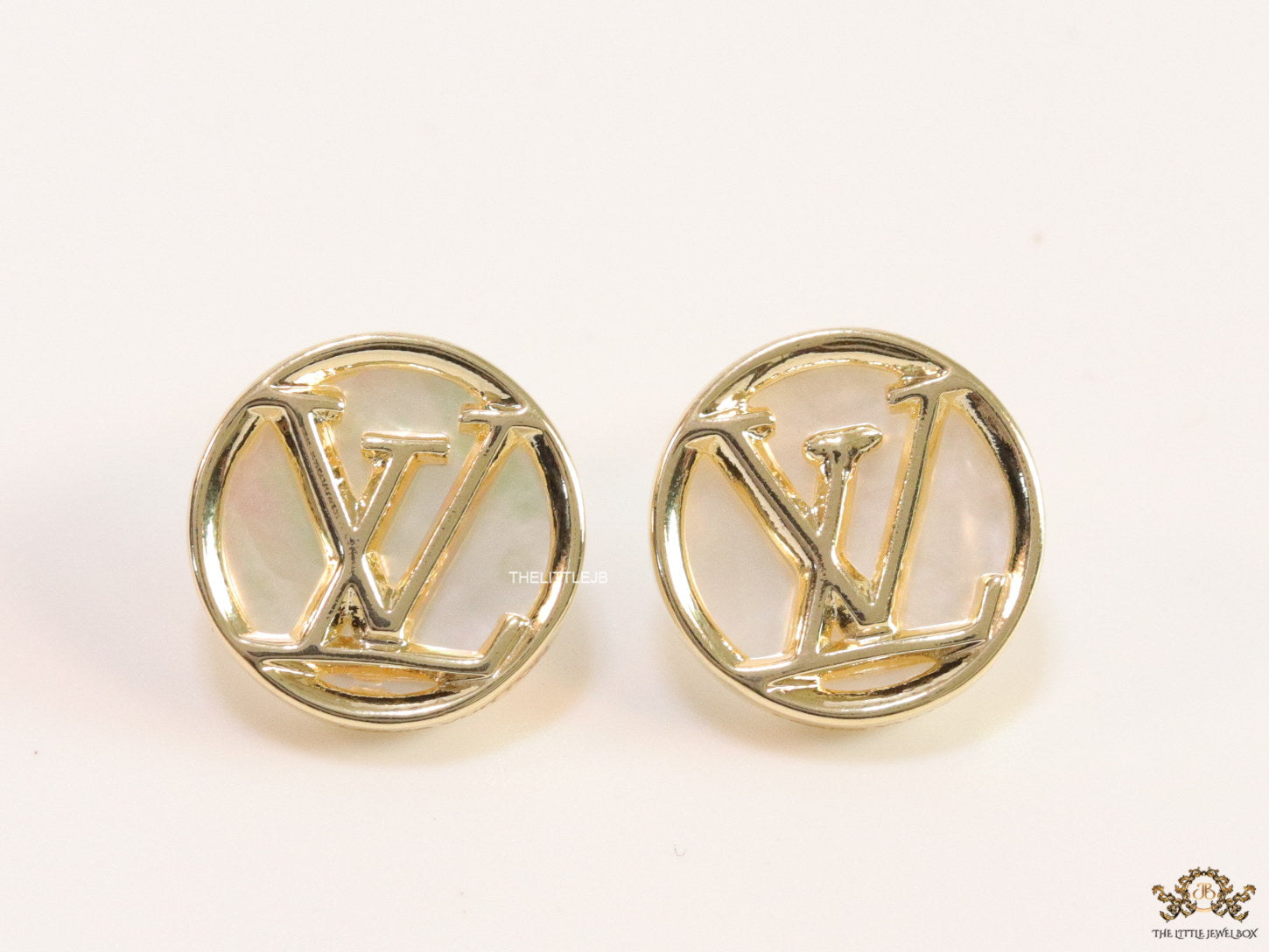 Gold plated alphabet motif studs in golden circular ring