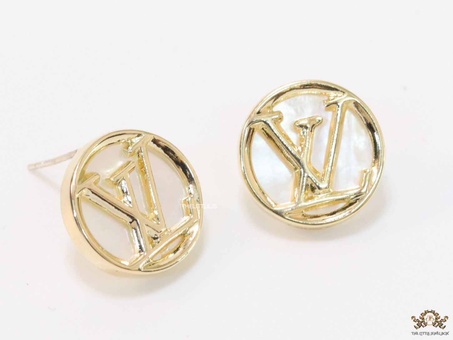 Gold plated alphabet motif studs in golden circular ring
