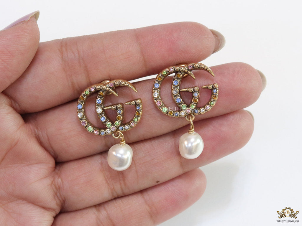 Double G golden earrings with multi color cz stones and pearl
