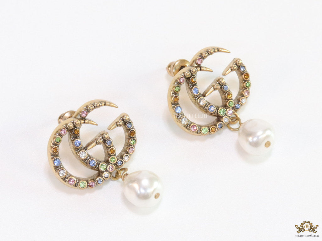 Double G golden earrings with multi color cz stones and pearl
