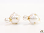 White pearl studs with golden alphabet motif and golden details