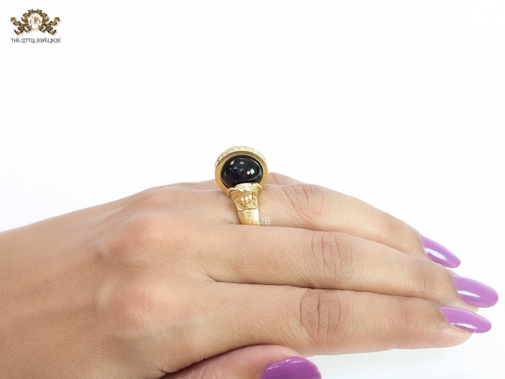 Double gold Medusa with CZ on black ball ring