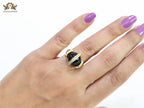 Double gold Medusa with CZ on black ball ring