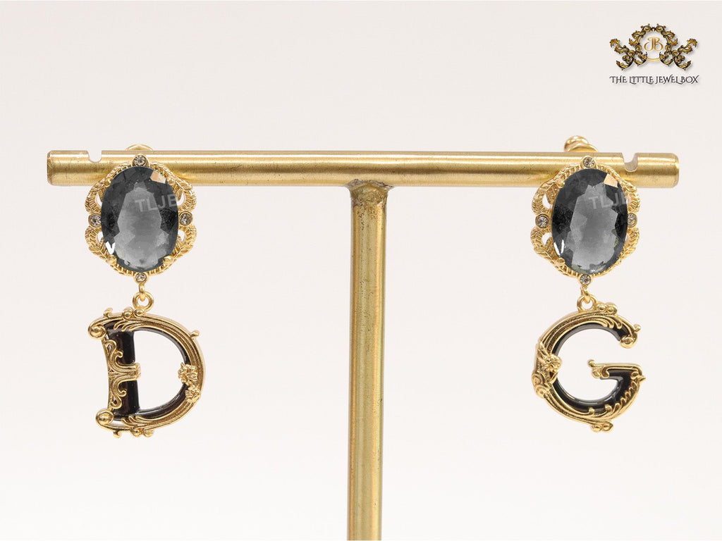 Semi-precious black stone with gold plated detailed with black and golden alphabet drop