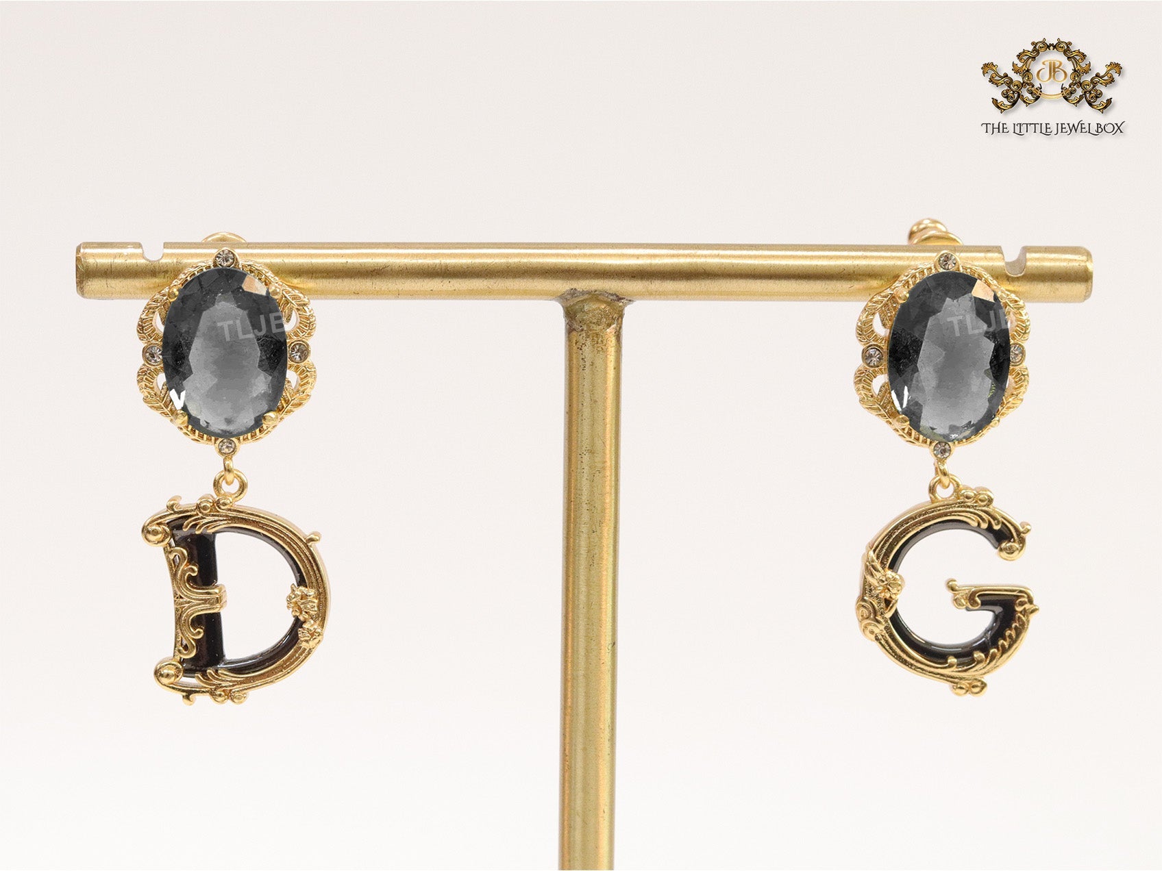 Semi-precious black stone with gold plated detailed with black and golden alphabet drop