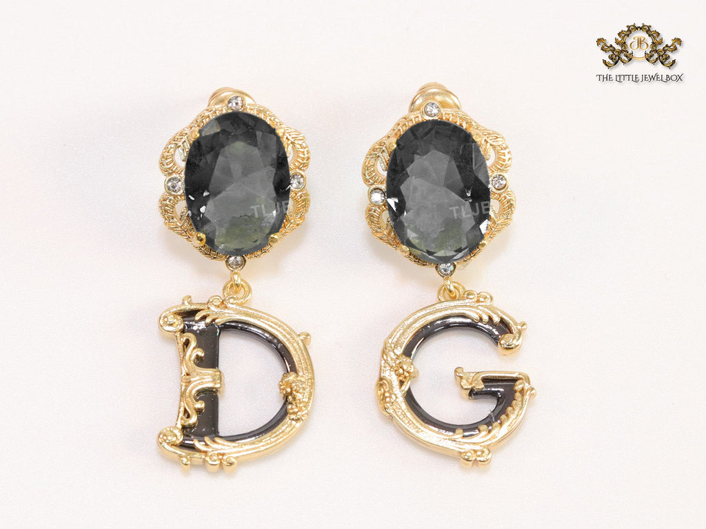 Semi-precious black stone with gold plated detailed with black and golden alphabet drop