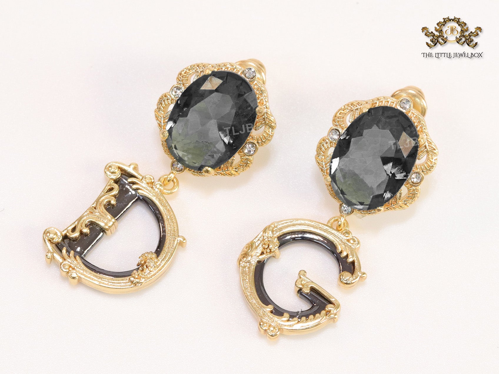 Semi-precious black stone with gold plated detailed with black and golden alphabet drop