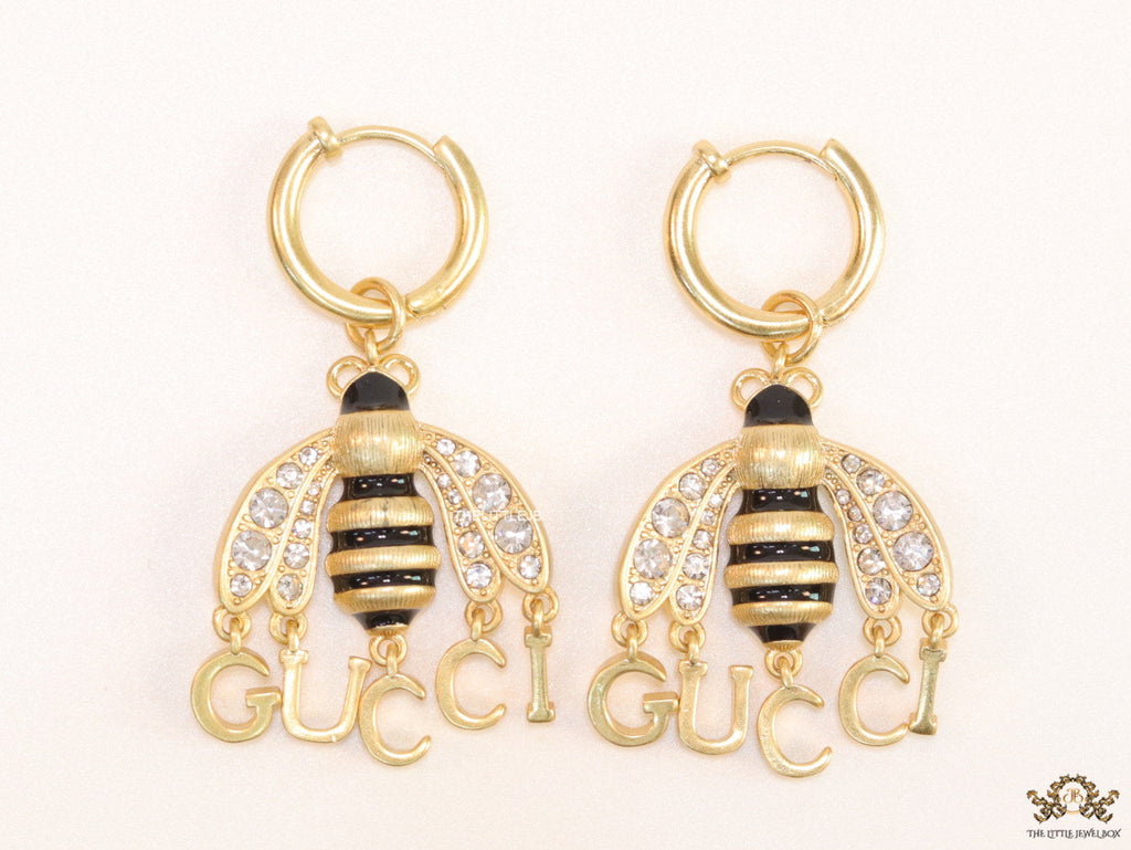 Simple gold plated hoops with golden and cubic zirconia stone queen bee and alphabets