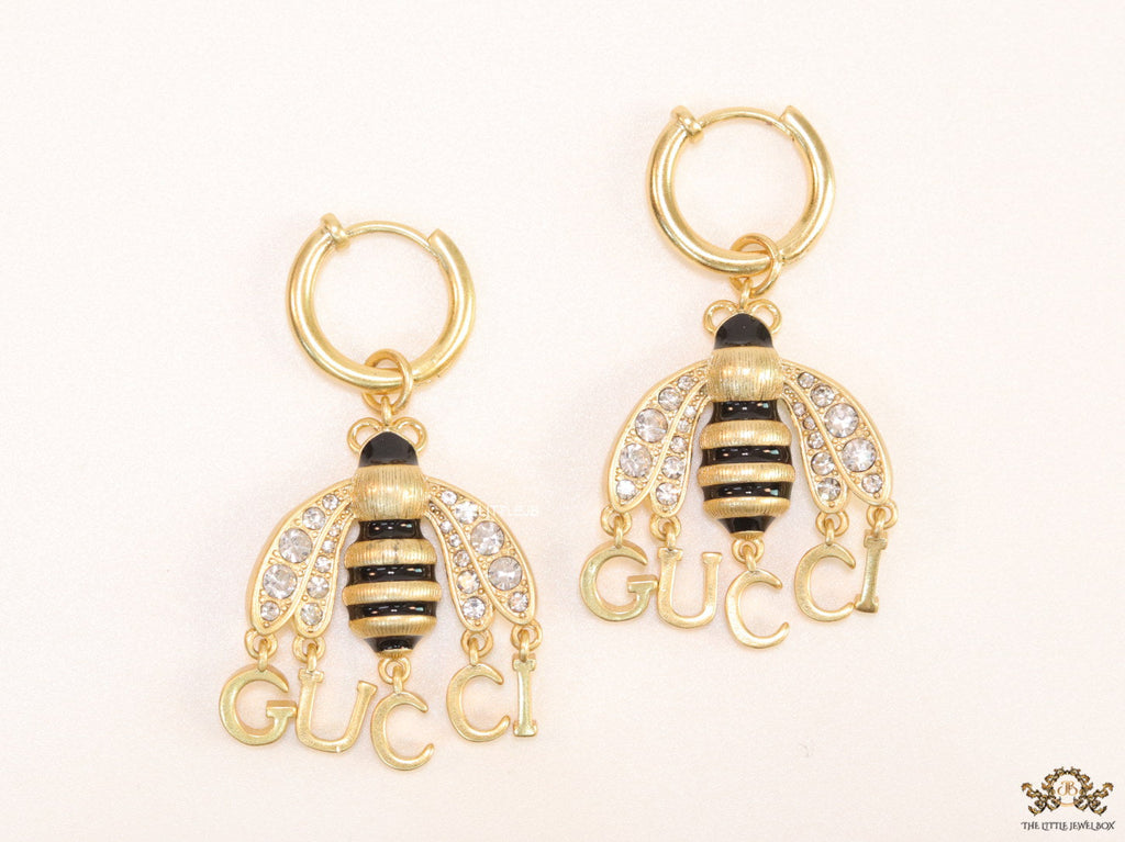 Simple gold plated hoops with golden and cubic zirconia stone queen bee and alphabets