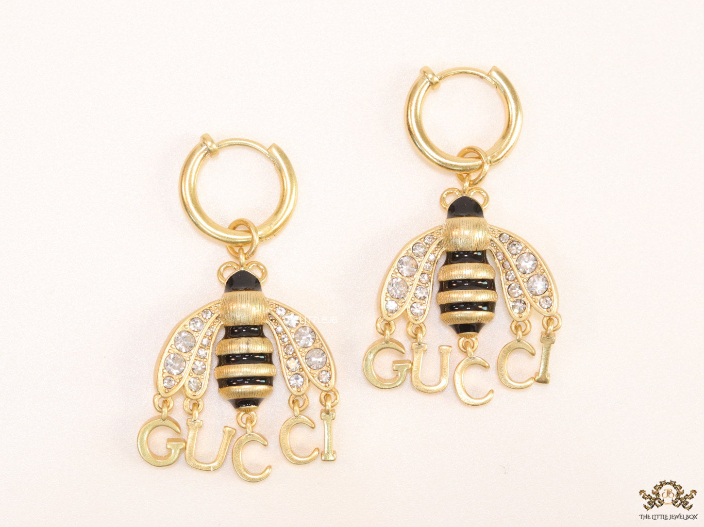 Simple gold plated hoops with golden and cubic zirconia stone queen bee and alphabets