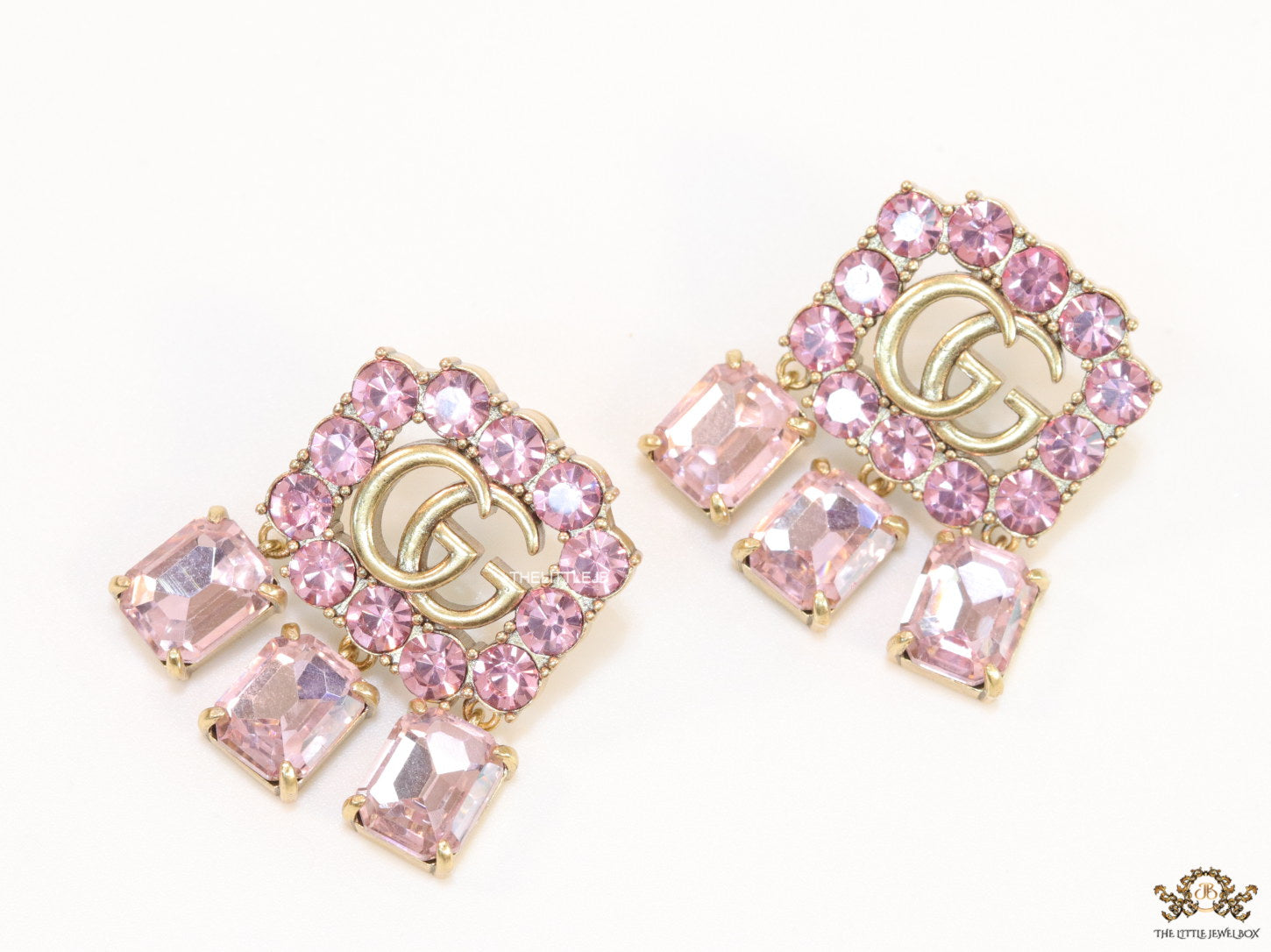 Lavender stone studes with gold plaetd double G motif and lavender stone drop