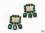 Emerald Green stone studs with gold plated double G motif and emerald green stone drop