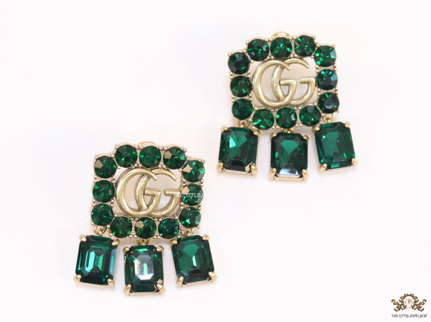 Emerald Green stone studs with gold plated double G motif and emerald green stone drop