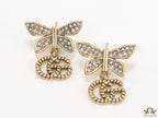 Studed cubic zirconia stone butterfly studs with textured double G motif drop