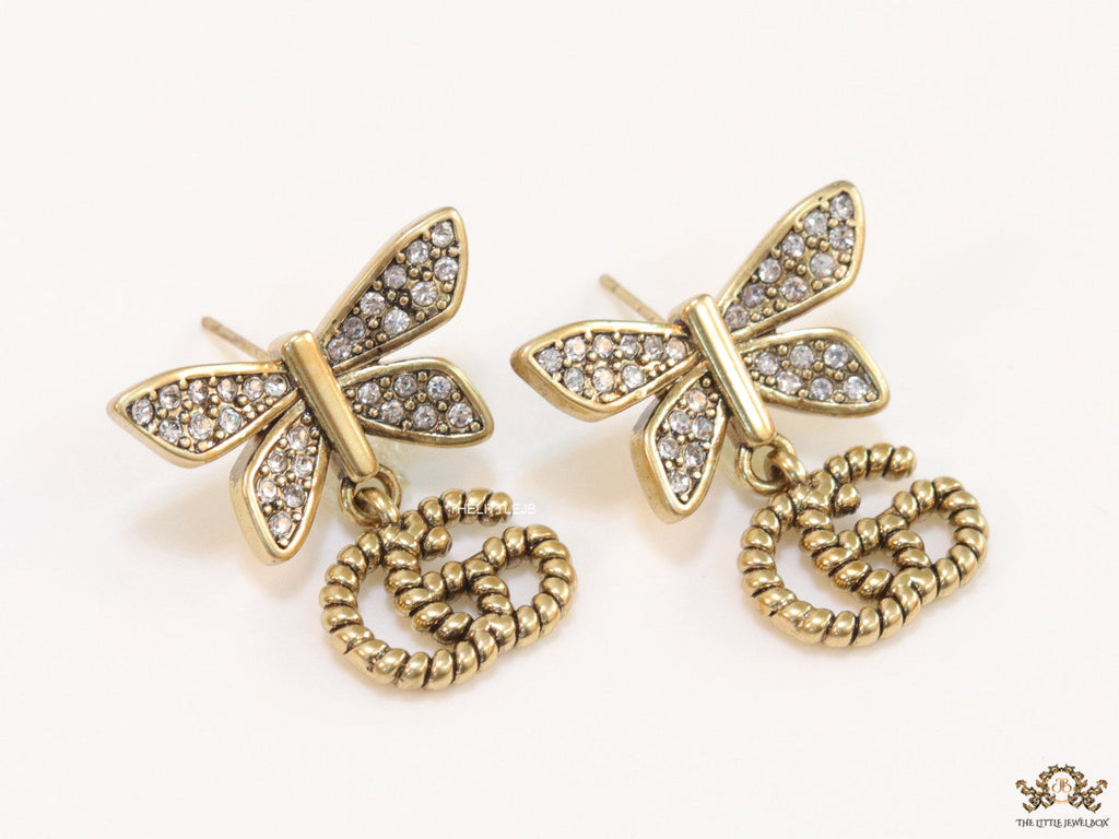 Studed cubic zirconia stone butterfly studs with textured double G motif drop