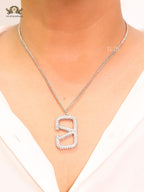 Open V Platinum plated vertical charm pendant with CZ