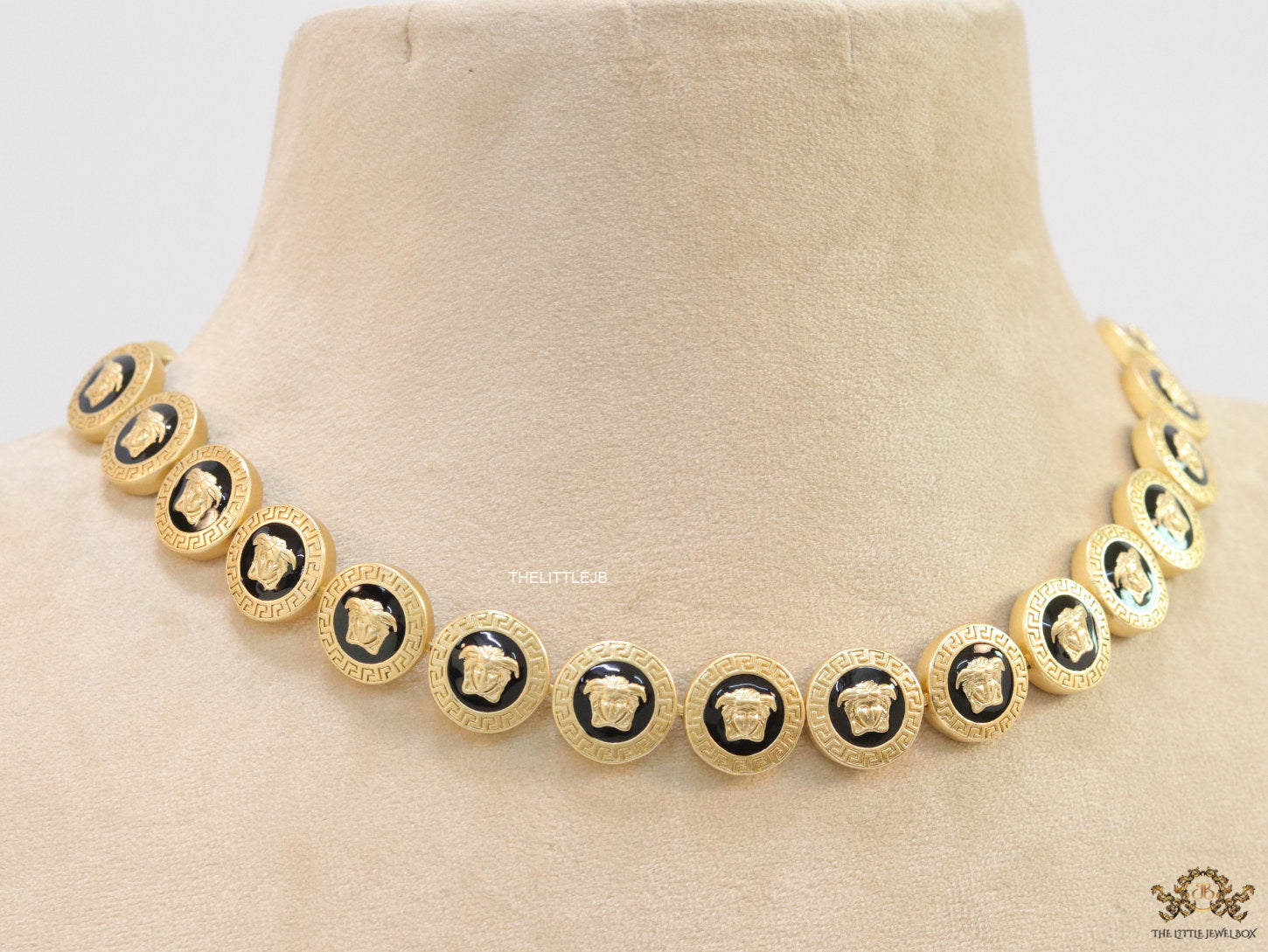 Gold plated Medusa motif on black circles necklace