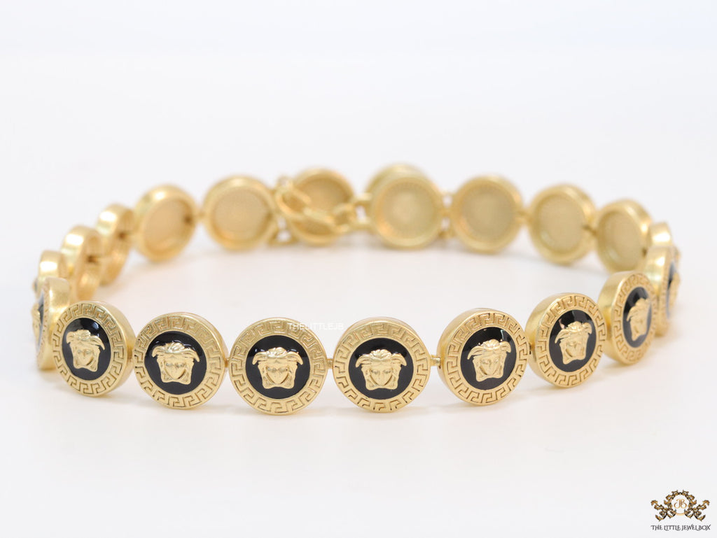 Gold plated Medusa motif on black circles necklace