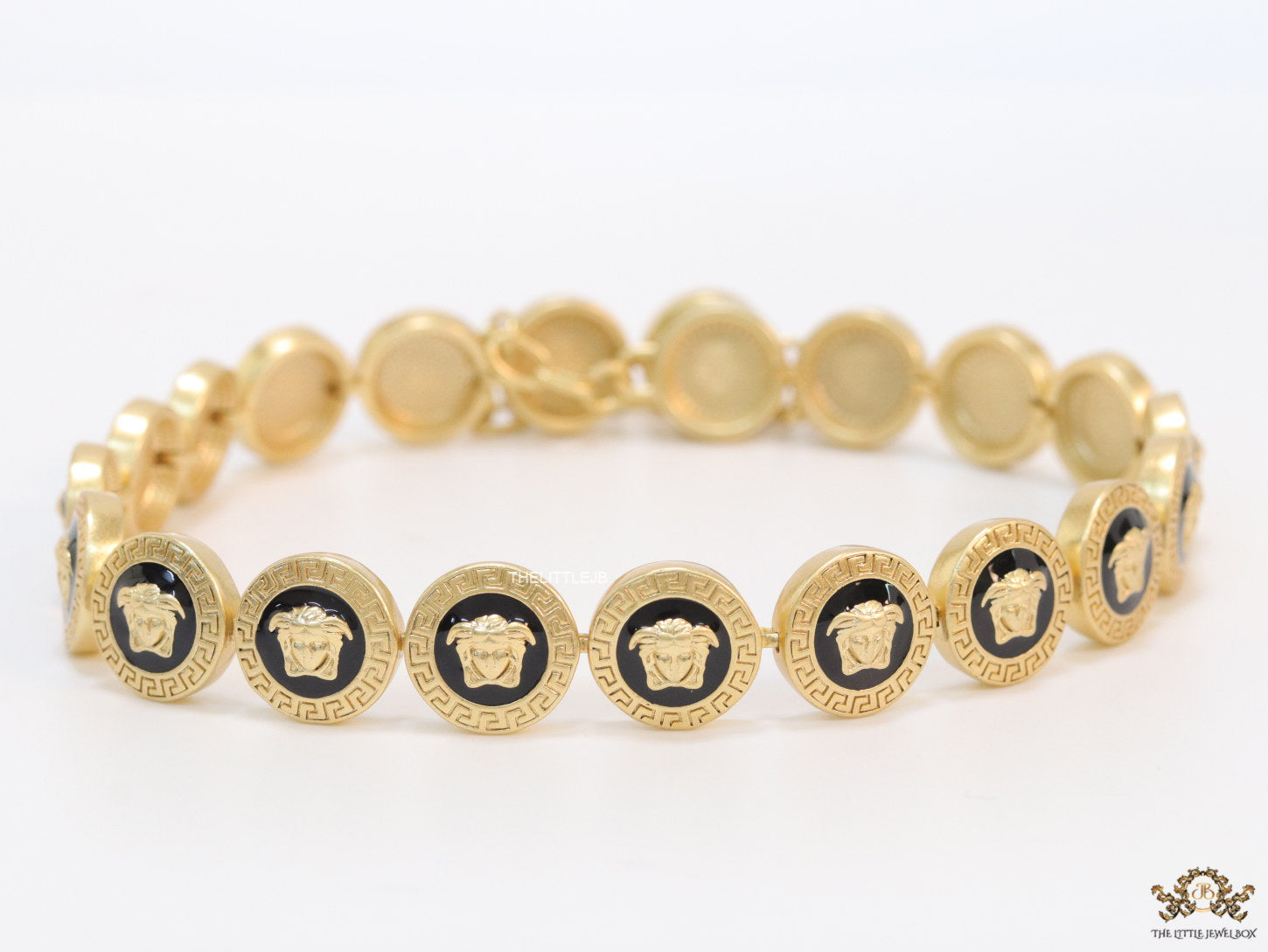 Gold plated Medusa motif on black circles necklace