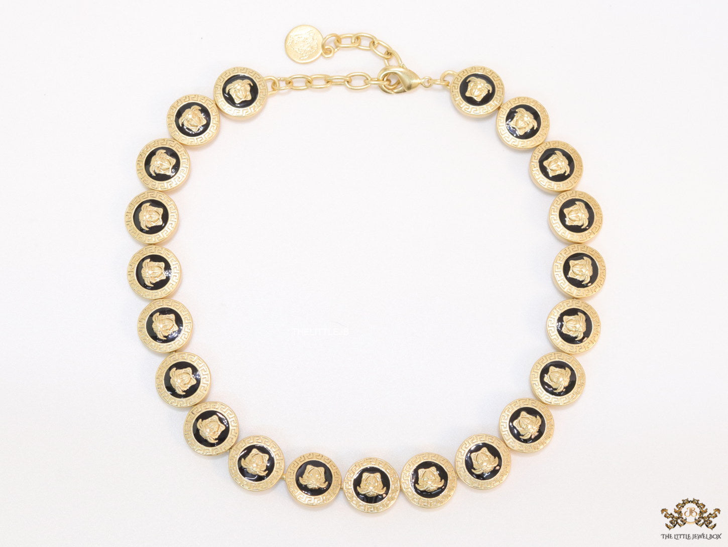 Gold plated Medusa motif on black circles necklace