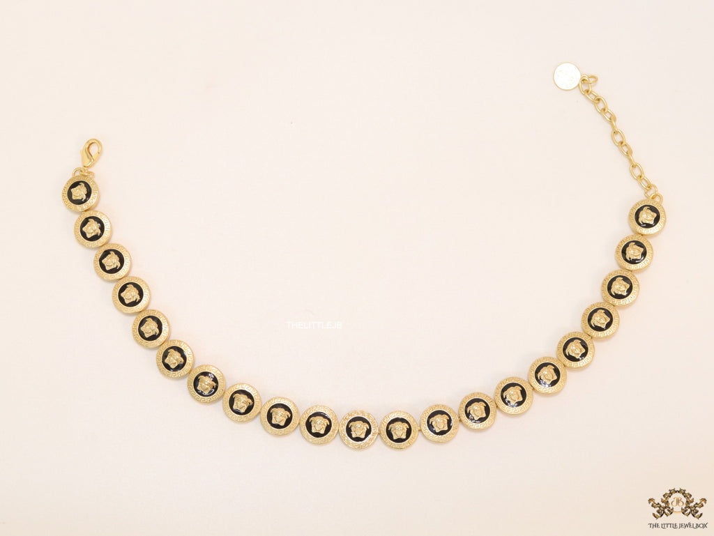 Gold plated Medusa motif on black circles necklace