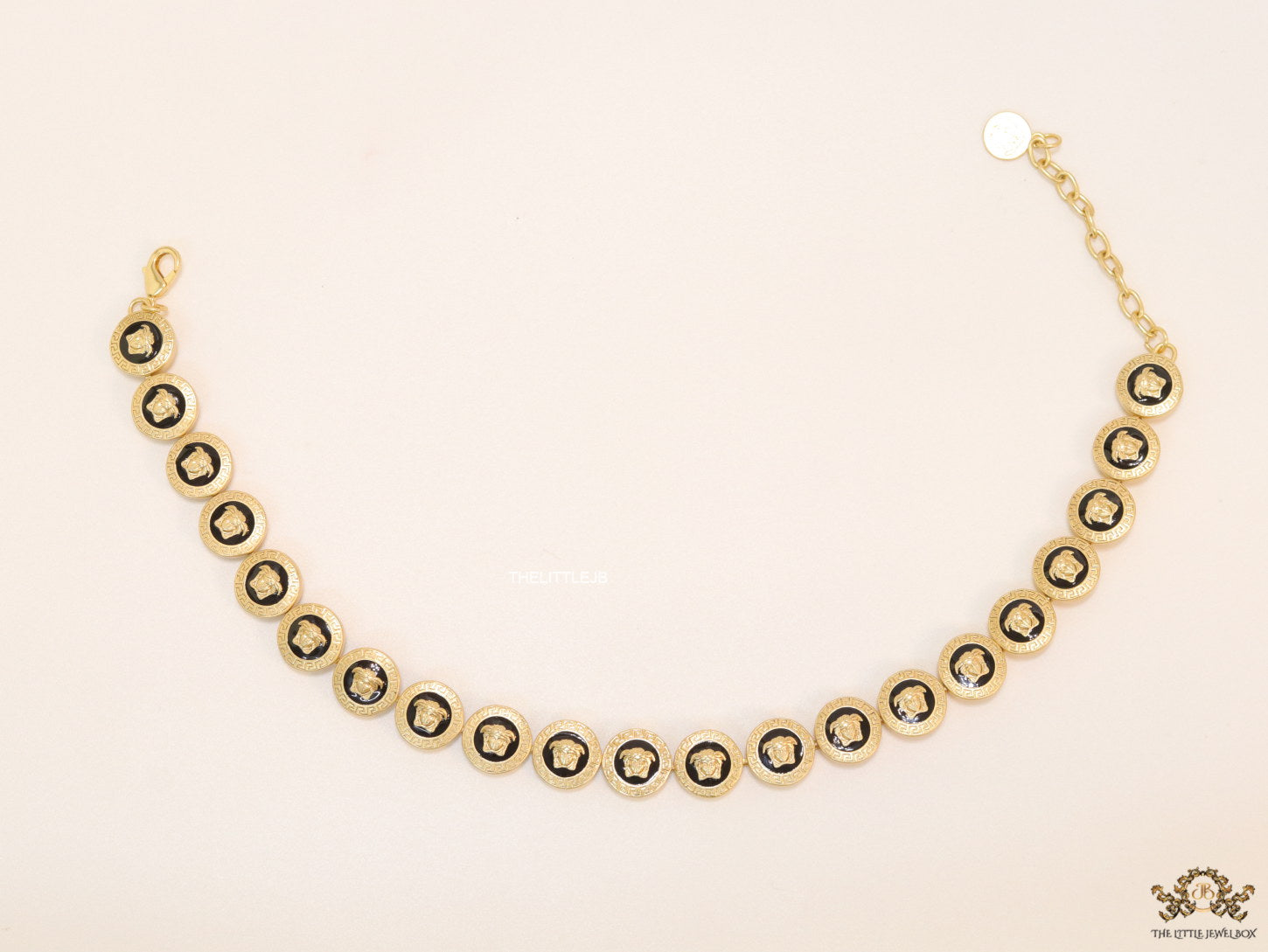 Gold plated Medusa motif on black circles necklace