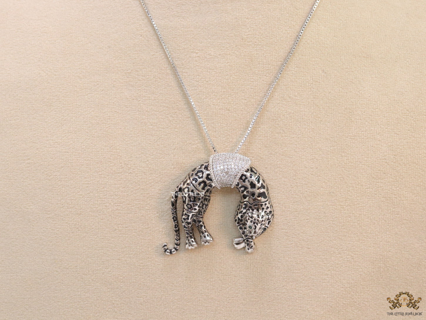 Platinum plated resting leopard pendant with cubic zirconia and Platinum chain