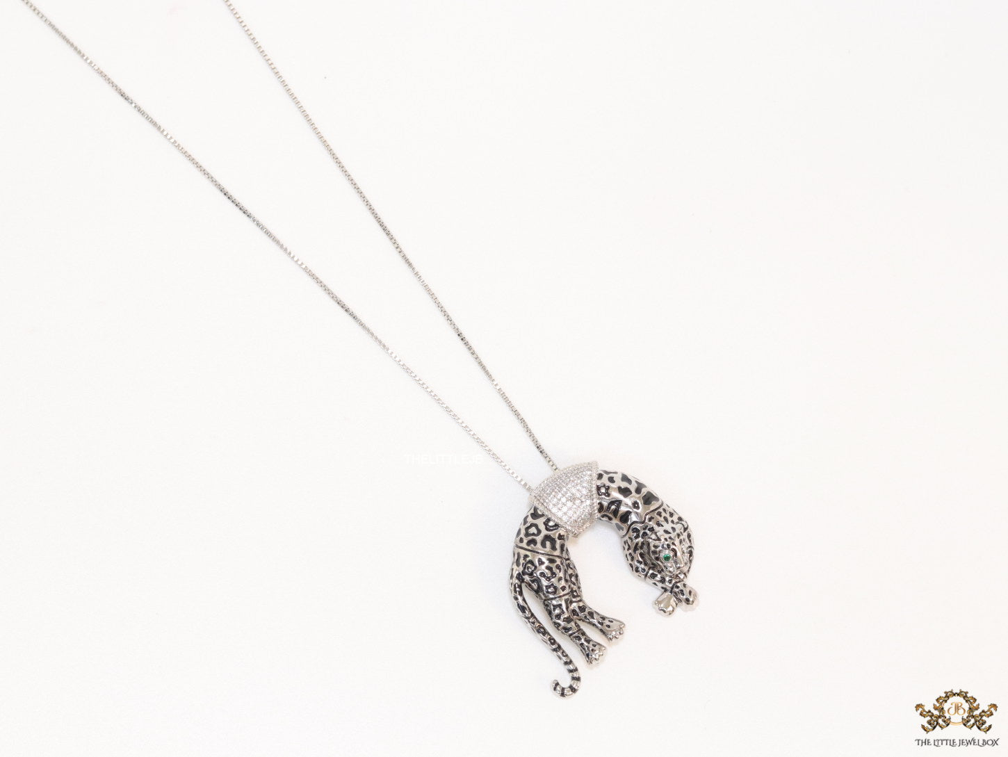 Platinum plated resting leopard pendant with cubic zirconia and Platinum chain