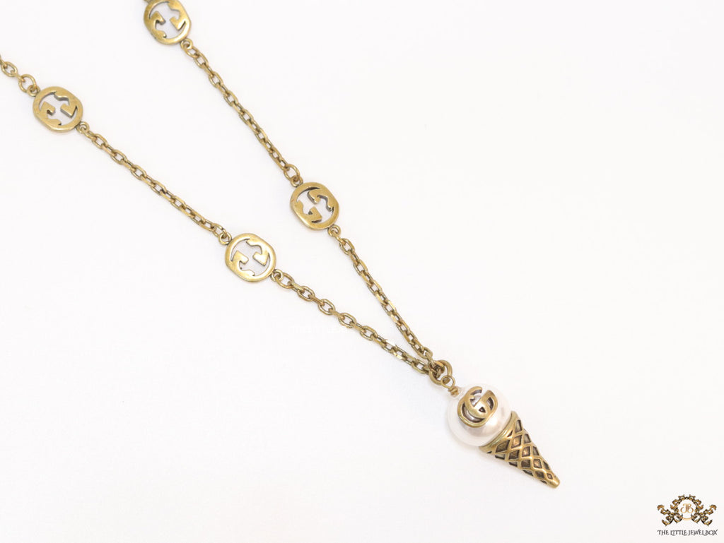 Antique gold plated alphabet motif chain with golden cone pendant
