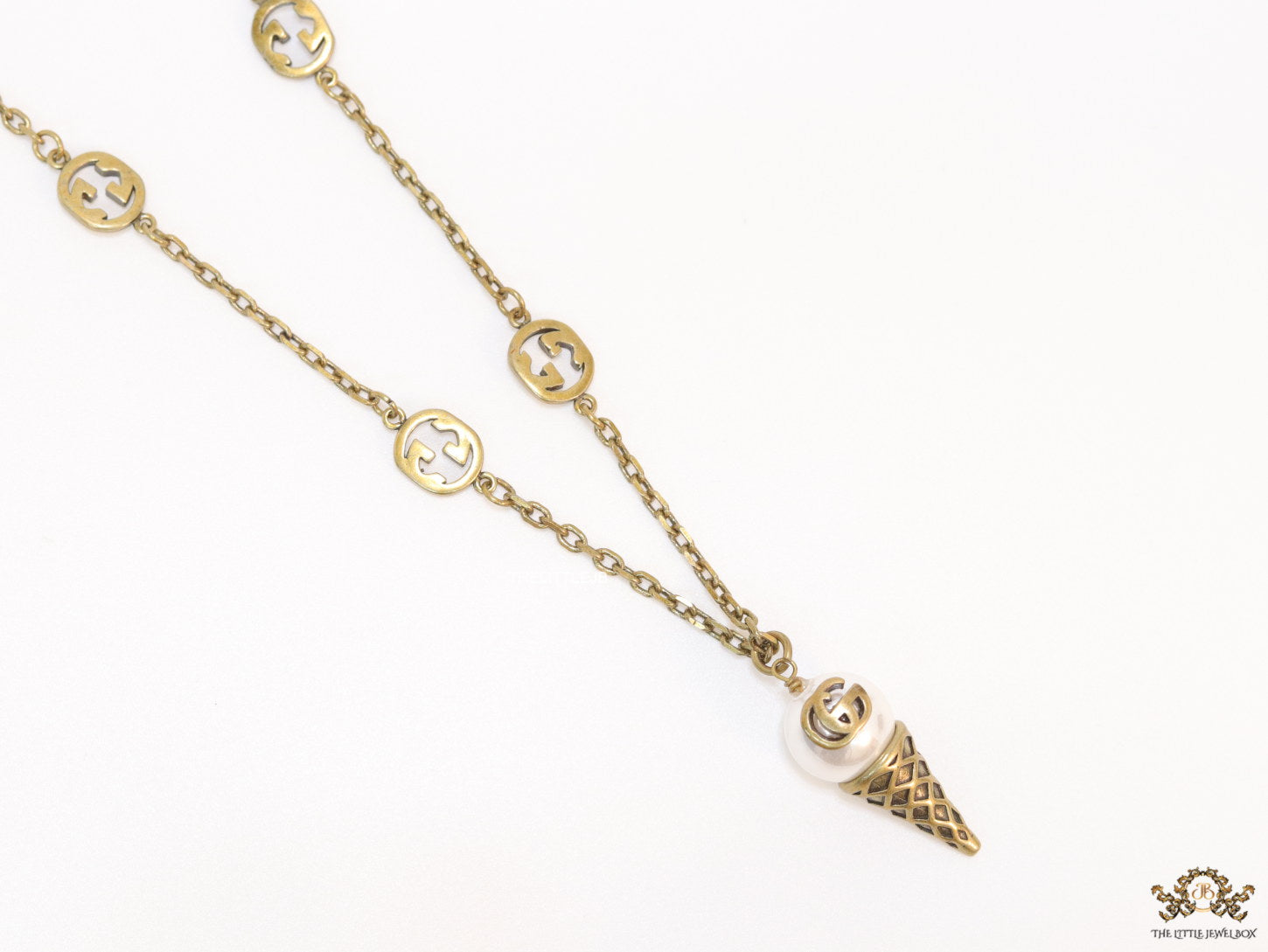 Antique gold plated alphabet motif chain with golden cone pendant