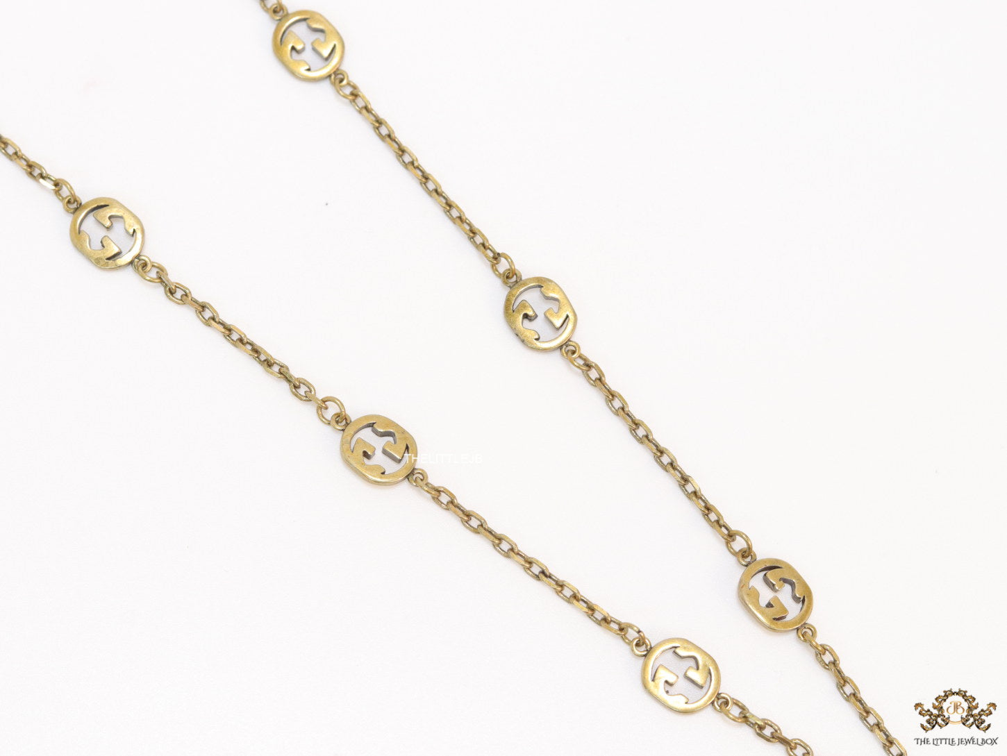 Antique gold plated alphabet motif chain with golden cone pendant