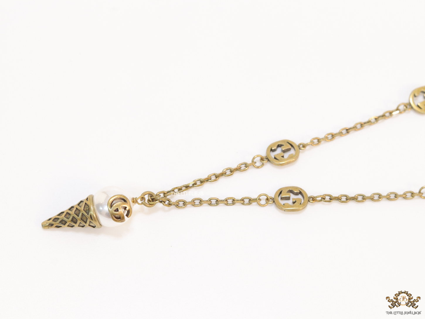 Antique gold plated alphabet motif chain with golden cone pendant