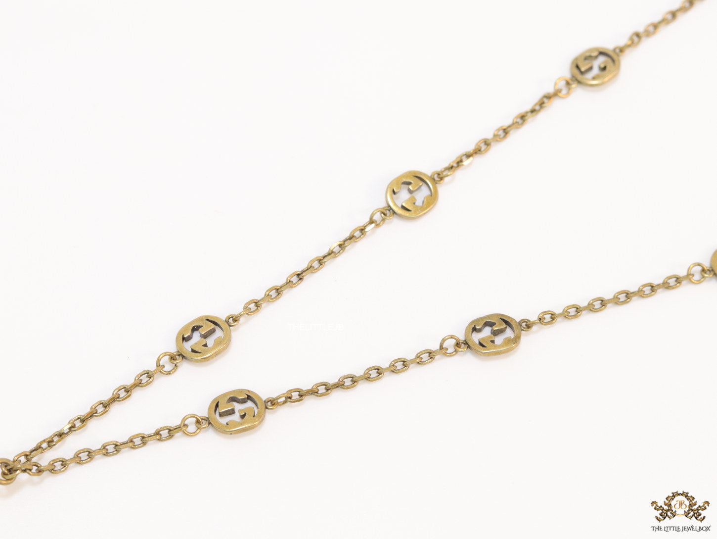 Antique gold plated alphabet motif chain with golden cone pendant