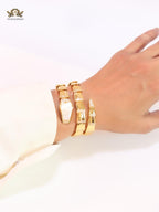 Bold gold and cz snake bracelet with mop head