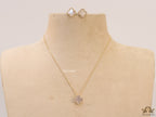 Sleek gold plated chain with cubic zirconia studded off-white clover shape pendant