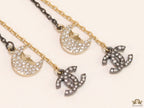 Dual chain star and moon dangles with double C motif