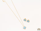 Sleek gold plated chain with cubic zirconia studded blue clover shape pendant