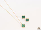 Sleek gold plated chain with cubic zirconia studded green clover shape pendant
